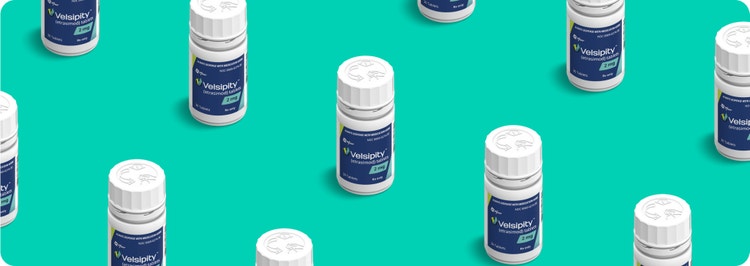 VELSIPITY™ (etrasimod) pill bottles against teal background